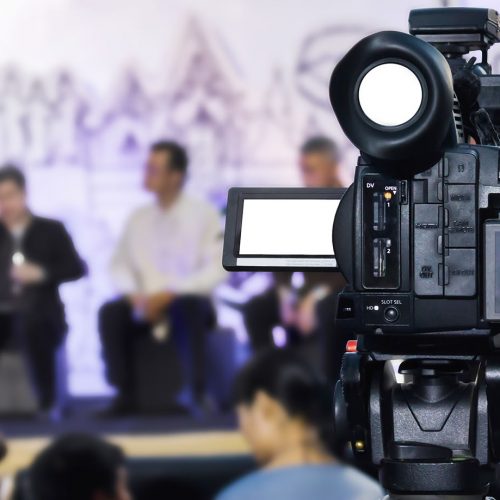 Video camera with blurred people in event